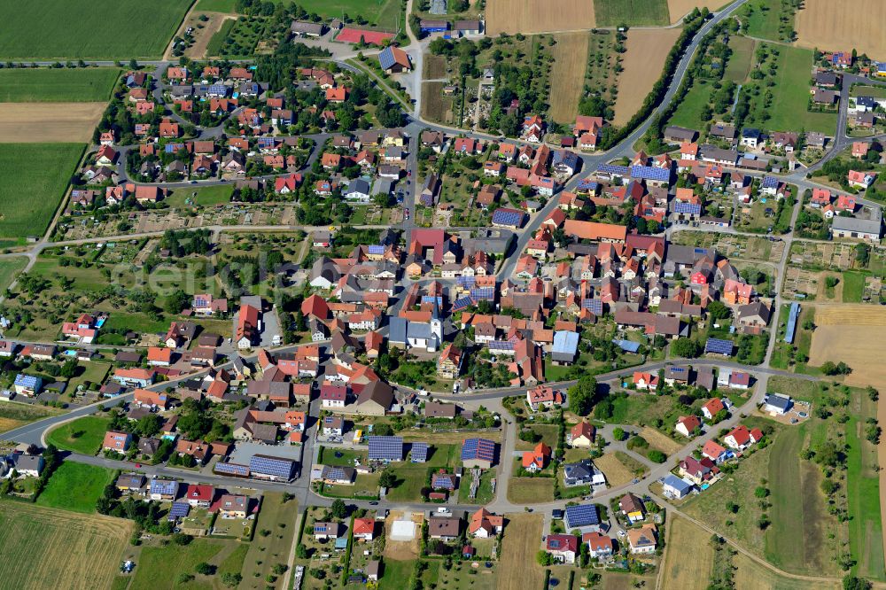 Dipbach from above - Village view on the edge of agricultural fields and land in Dipbach in the state Bavaria, Germany