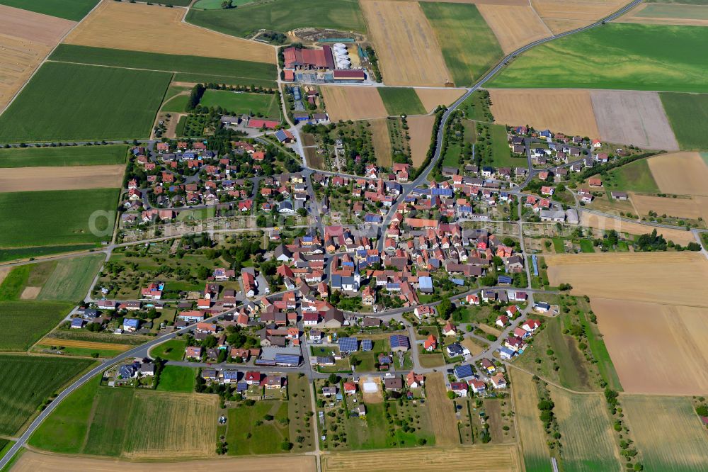 Aerial image Dipbach - Village view on the edge of agricultural fields and land in Dipbach in the state Bavaria, Germany