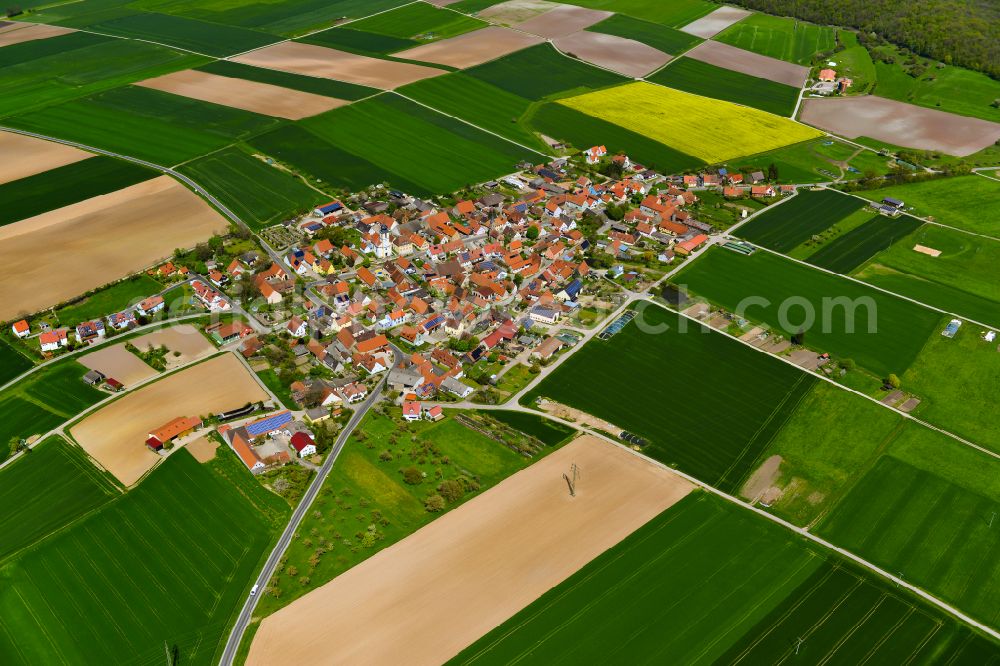 Dornheim from above - Village view on the edge of agricultural fields and land in Dornheim in the state Bavaria, Germany