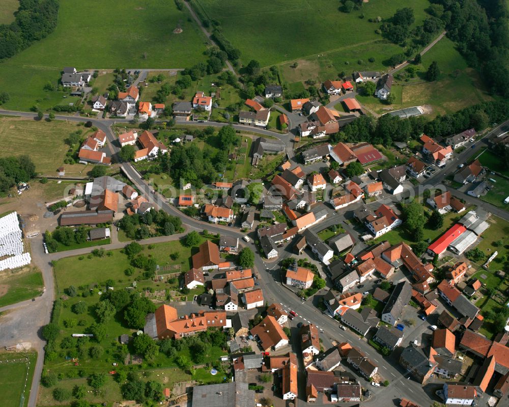 Aerial image Eichelsachsen - Village view on the edge of agricultural fields and land in Eichelsachsen in the state Hesse, Germany