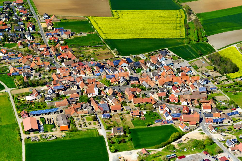 Eichfeld from above - Village view on the edge of agricultural fields and land in Eichfeld in the state Bavaria, Germany