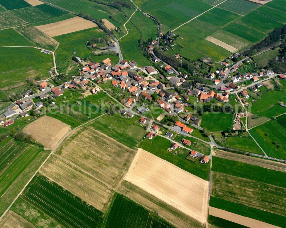 Erbenhausen from the bird's eye view: Village view on the edge of agricultural fields and land in Erbenhausen in the state Hesse, Germany