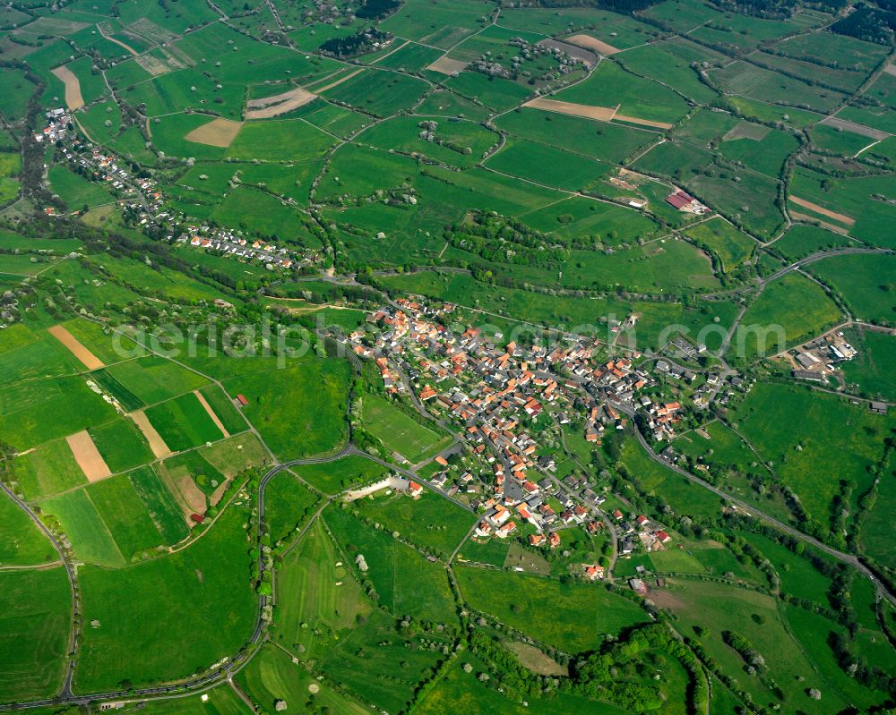 Aerial image Eschenrod - Village view on the edge of agricultural fields and land in Eschenrod in the state Hesse, Germany