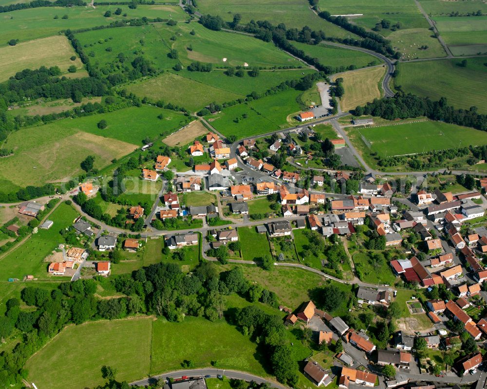 Aerial image Eschenrod - Village view on the edge of agricultural fields and land in Eschenrod in the state Hesse, Germany