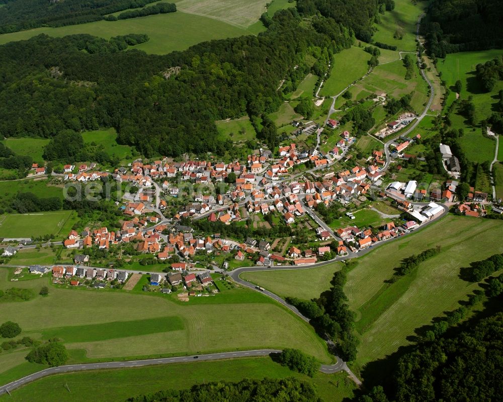 Faulungen from the bird's eye view: Village view on the edge of agricultural fields and land in Faulungen in the state Thuringia, Germany