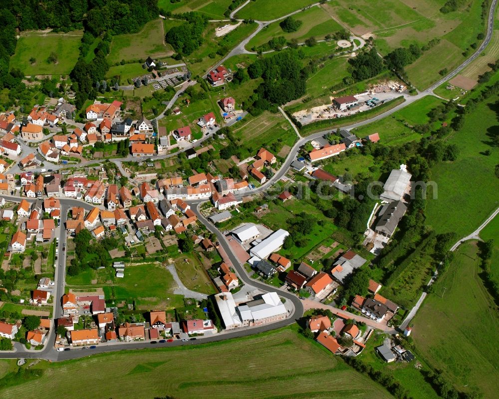 Aerial image Faulungen - Village view on the edge of agricultural fields and land in Faulungen in the state Thuringia, Germany