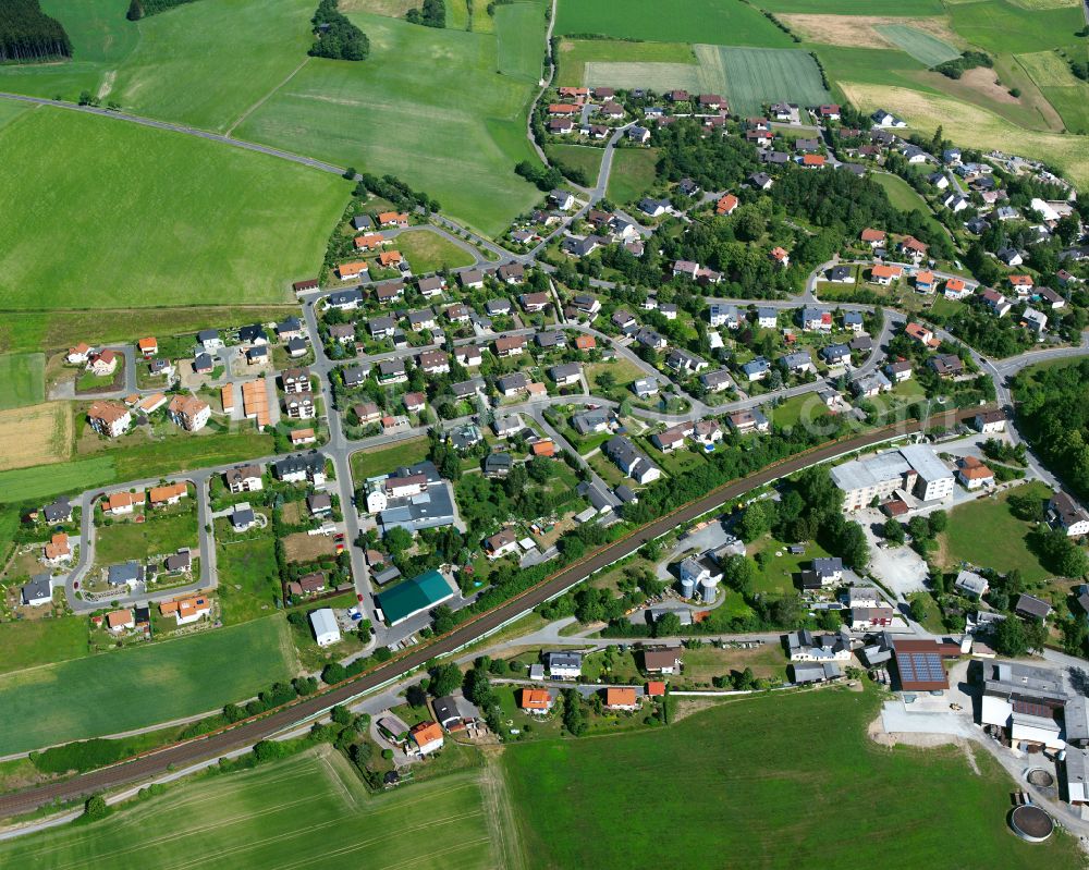 Aerial image Feilitzsch - Village view on the edge of agricultural fields and land on street Flurstrasse in Feilitzsch in the state Bavaria, Germany