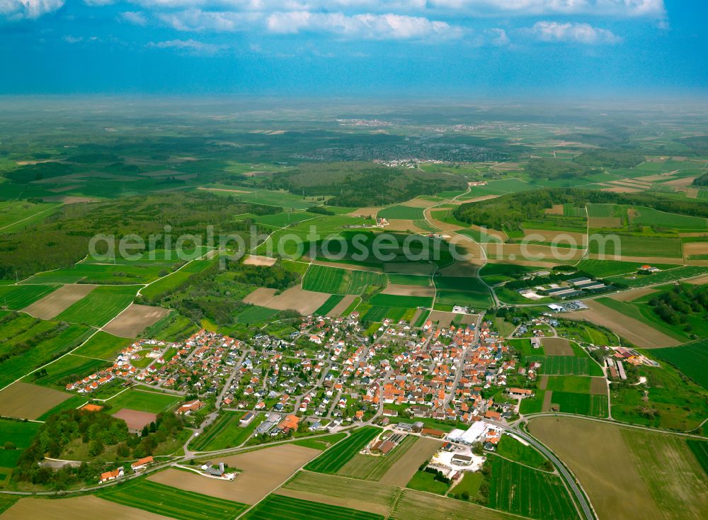 Feldstetten from the bird's eye view: Village view on the edge of agricultural fields and land in Feldstetten in the state Baden-Wuerttemberg, Germany