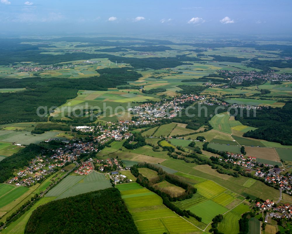 Flensungen from above - Village view on the edge of agricultural fields and land in Flensungen in the state Hesse, Germany