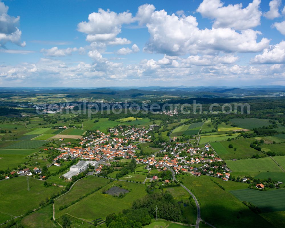 Aerial photograph Frischborn - Village view on the edge of agricultural fields and land in Frischborn in the state Hesse, Germany