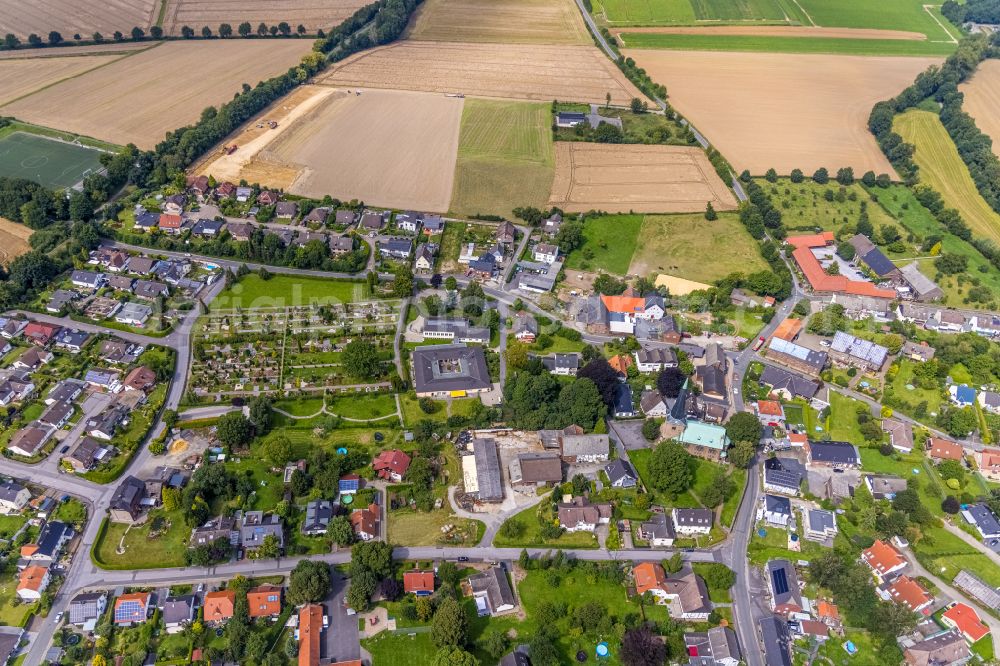 Frömern from the bird's eye view: Village view on the edge of agricultural fields and land in Frömern in the state North Rhine-Westphalia, Germany