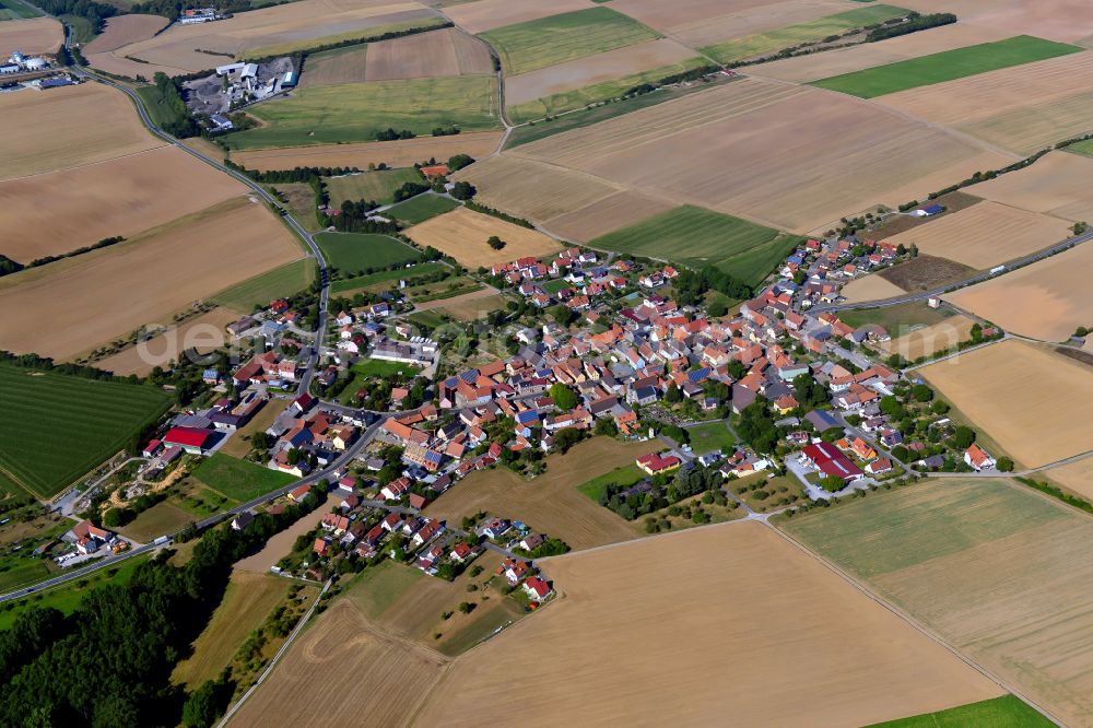 Fuchsstadt from the bird's eye view: Village view on the edge of agricultural fields and land in Fuchsstadt in the state Bavaria, Germany