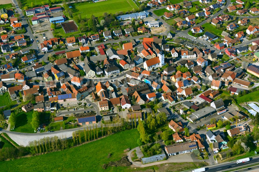 Geiselwind from the bird's eye view: Village view on the edge of agricultural fields and land in Geiselwind in the state Bavaria, Germany