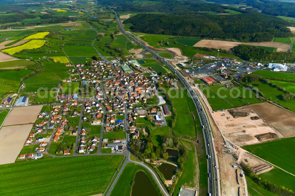 Geiselwind from above - Village view on the edge of agricultural fields and land in Geiselwind in the state Bavaria, Germany