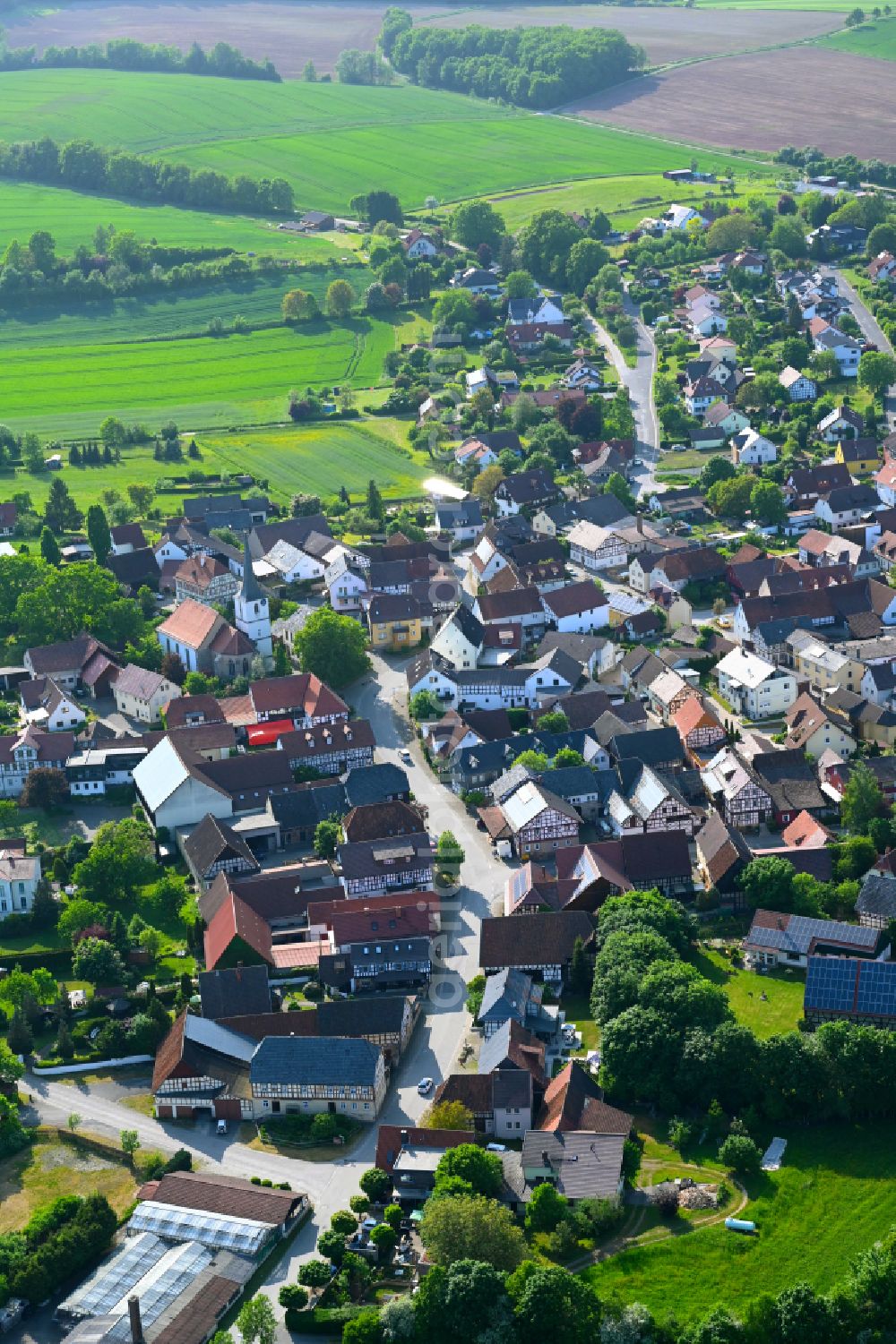 Gemünda from above - Village view on the edge of agricultural fields and land in Gemünda in the state Bavaria, Germany