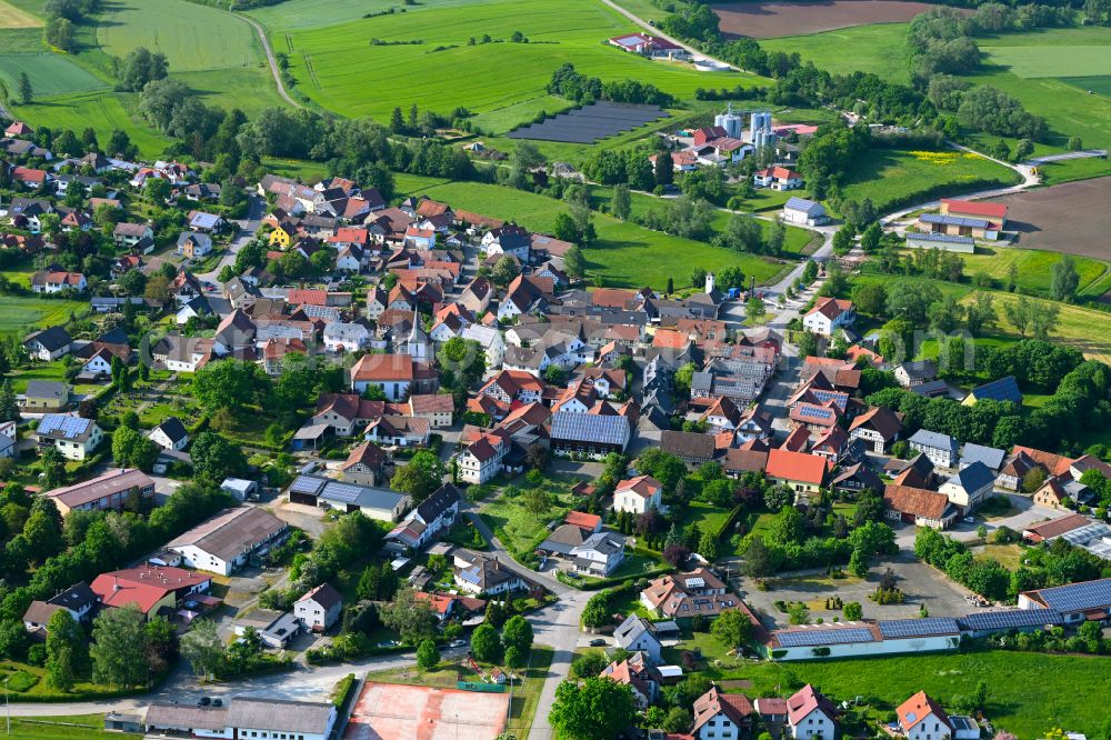 Gemünda i.OFr. from above - Village view on the edge of agricultural fields and land in Gemünda i.OFr. in the state Bavaria, Germany