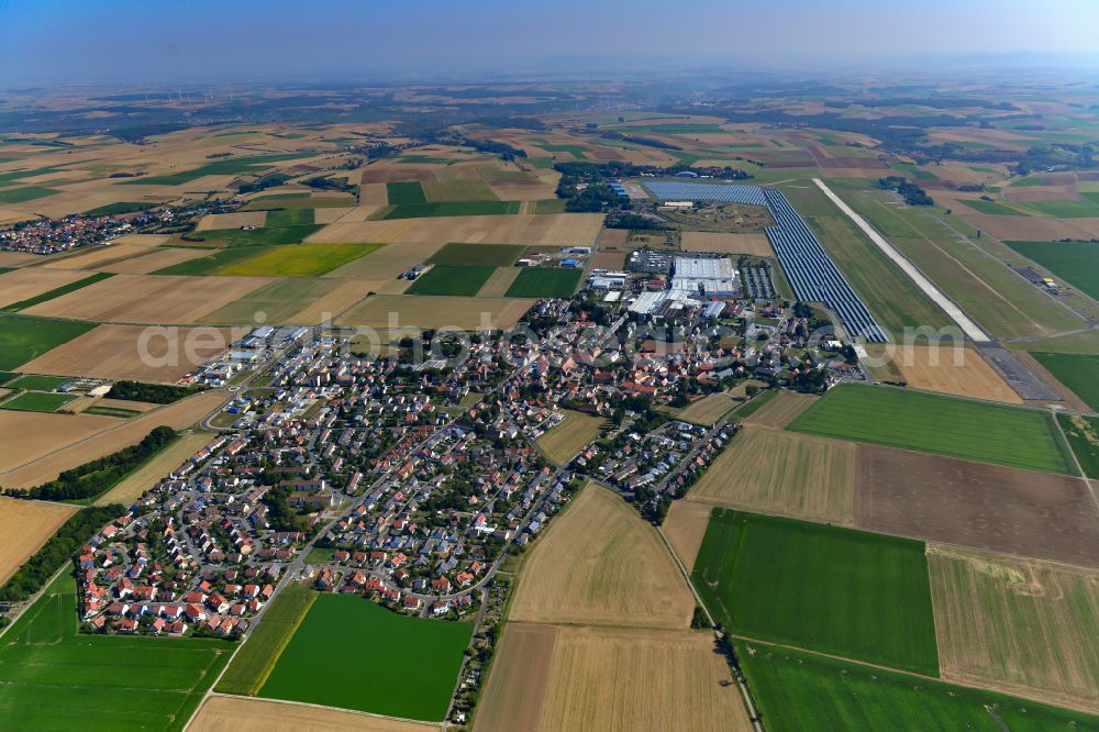 Aerial image Giebelstadt - Village view on the edge of agricultural fields and land in Giebelstadt in the state Bavaria, Germany