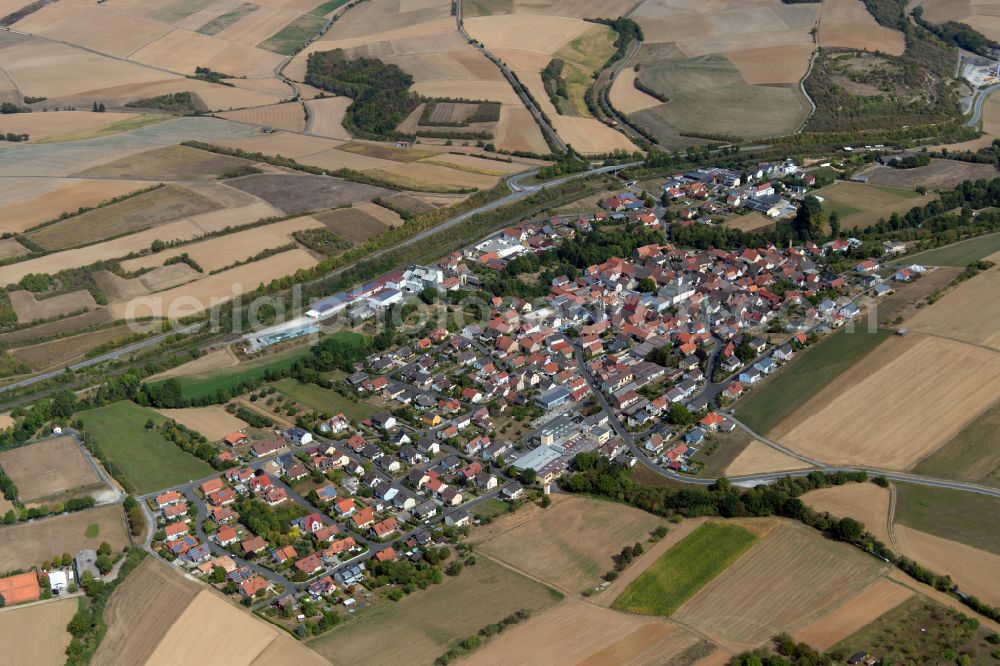 Gänheim from the bird's eye view: Village view on the edge of agricultural fields and land in Gänheim in the state Bavaria, Germany