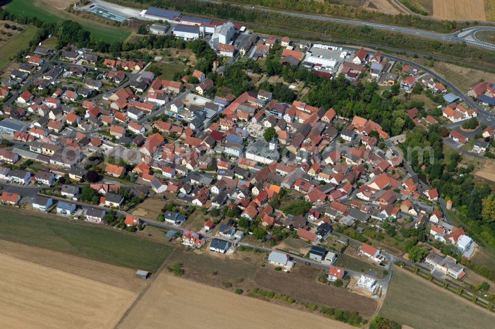 Aerial image Gänheim - Village view on the edge of agricultural fields and land in Gänheim in the state Bavaria, Germany