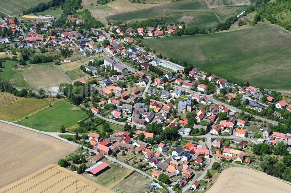 Golmsdorf from above - Village view on the edge of agricultural fields and land in Golmsdorf in the state Thuringia, Germany