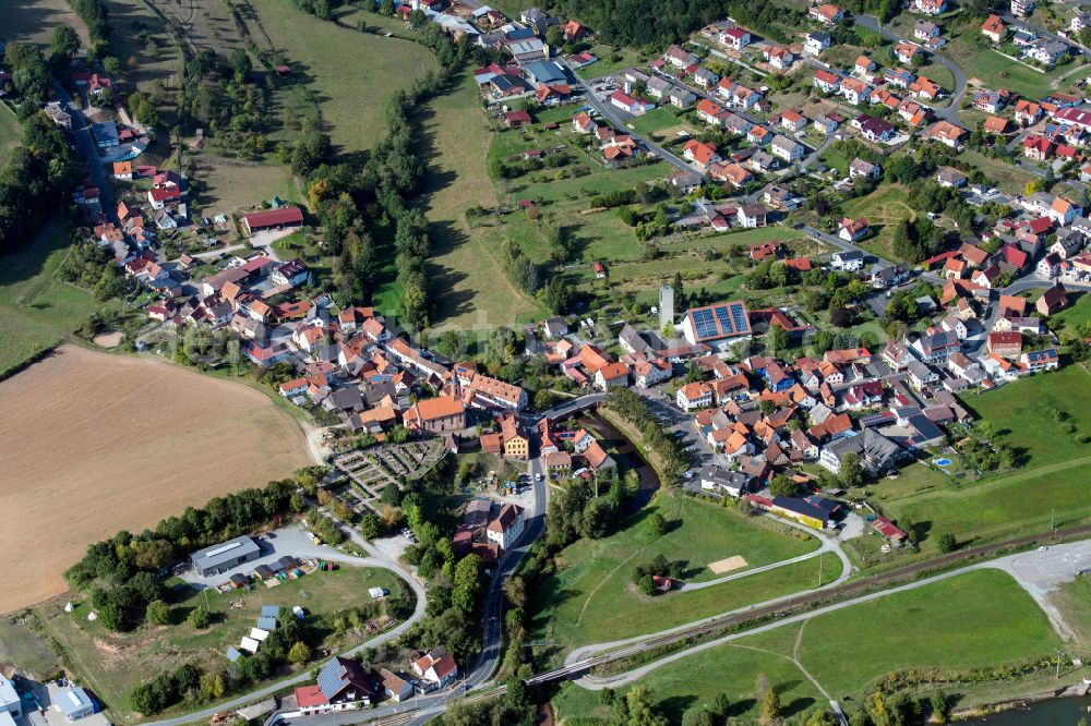 Aerial image Gräfendorf - Village view on the edge of agricultural fields and land in Gräfendorf in the state Bavaria, Germany