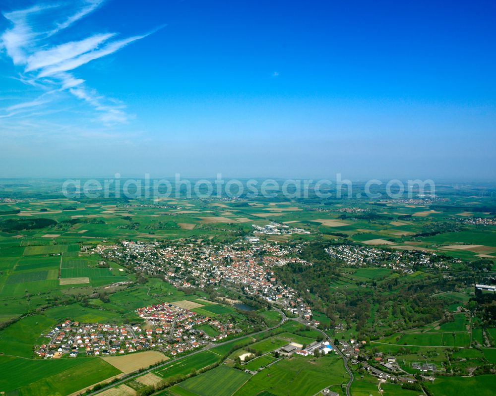 Grünberg from the bird's eye view: Village view on the edge of agricultural fields and land in Grünberg in the state Hesse, Germany