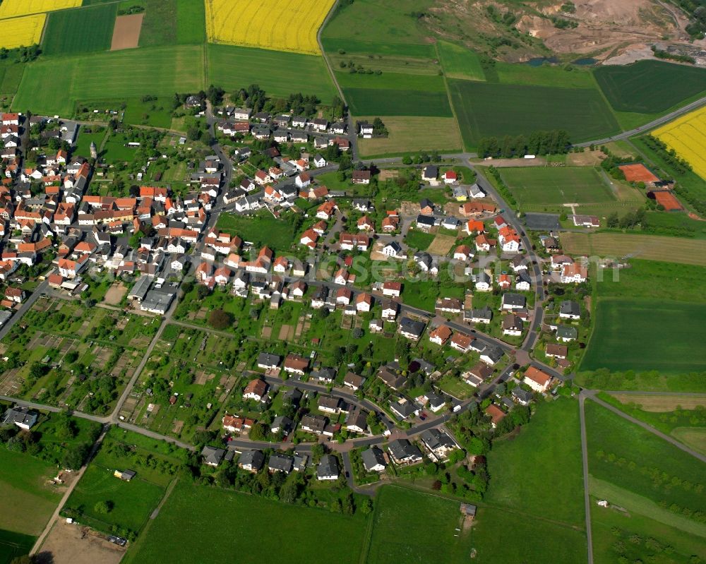 Aerial photograph Grüningen - Village view on the edge of agricultural fields and land in Grüningen in the state Hesse, Germany