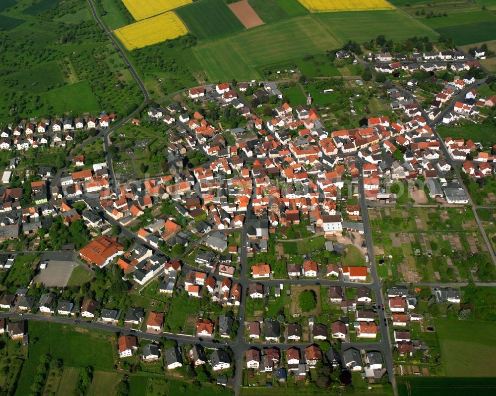 Grüningen from above - Village view on the edge of agricultural fields and land in Grüningen in the state Hesse, Germany