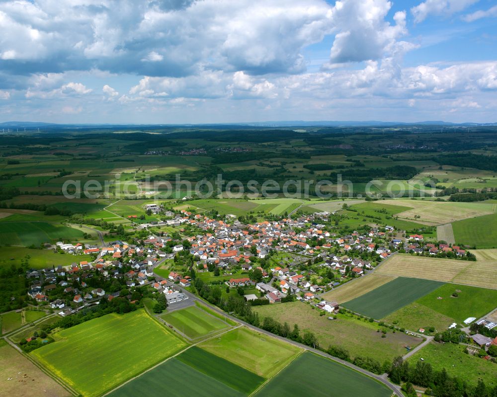 Groß Eichen from the bird's eye view: Village view on the edge of agricultural fields and land in Groß Eichen in the state Hesse, Germany