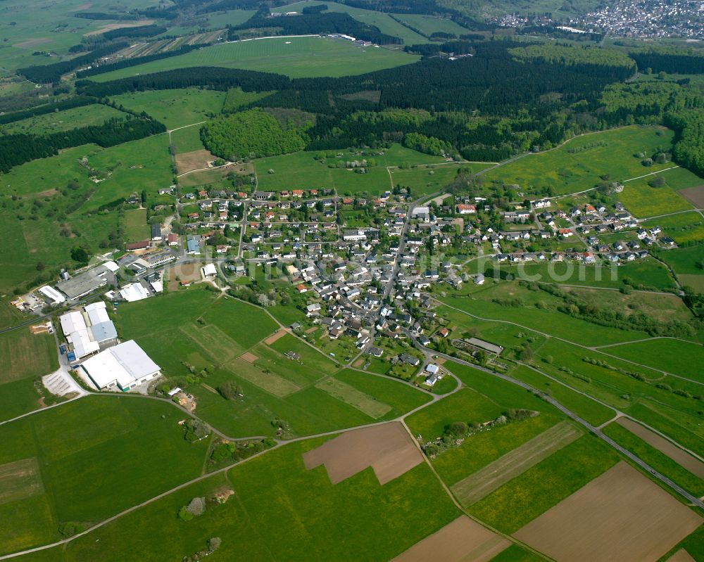 Gusternhain from the bird's eye view: Village view on the edge of agricultural fields and land in Gusternhain in the state Hesse, Germany