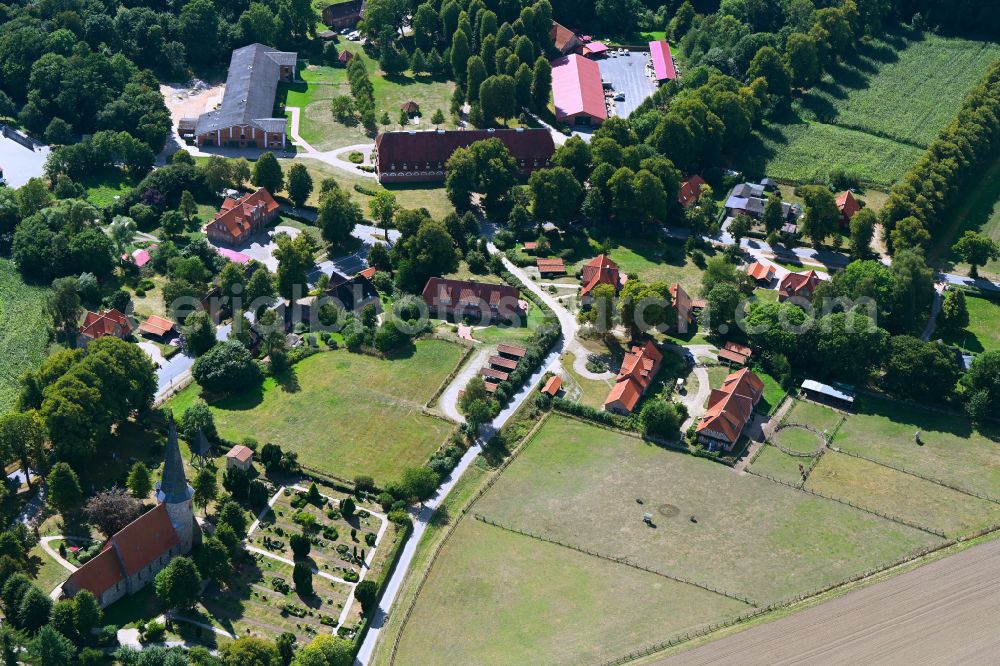 Aerial image Pronstorf - Village view on the edge of agricultural fields and land with dem Gut Pronstorf in Pronstorf in the state Schleswig-Holstein, Germany