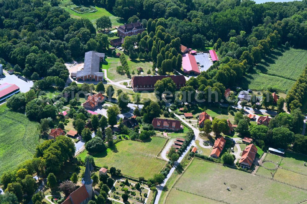 Aerial photograph Pronstorf - Village view on the edge of agricultural fields and land with dem Gut Pronstorf in Pronstorf in the state Schleswig-Holstein, Germany