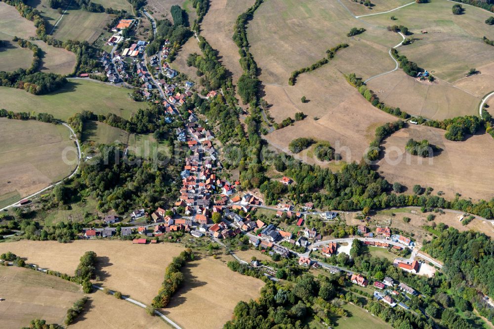 Aerial image Habichsthal - Village view on the edge of agricultural fields and land in Habichsthal in the state Bavaria, Germany