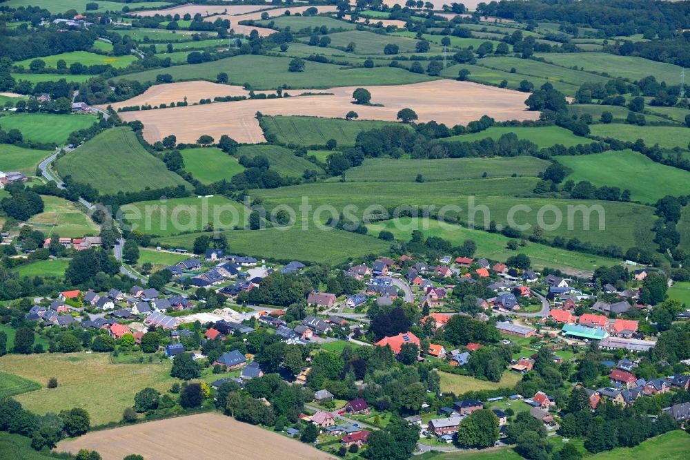 Haby from the bird's eye view: Village view on the edge of agricultural fields and land in Haby in the state Schleswig-Holstein, Germany