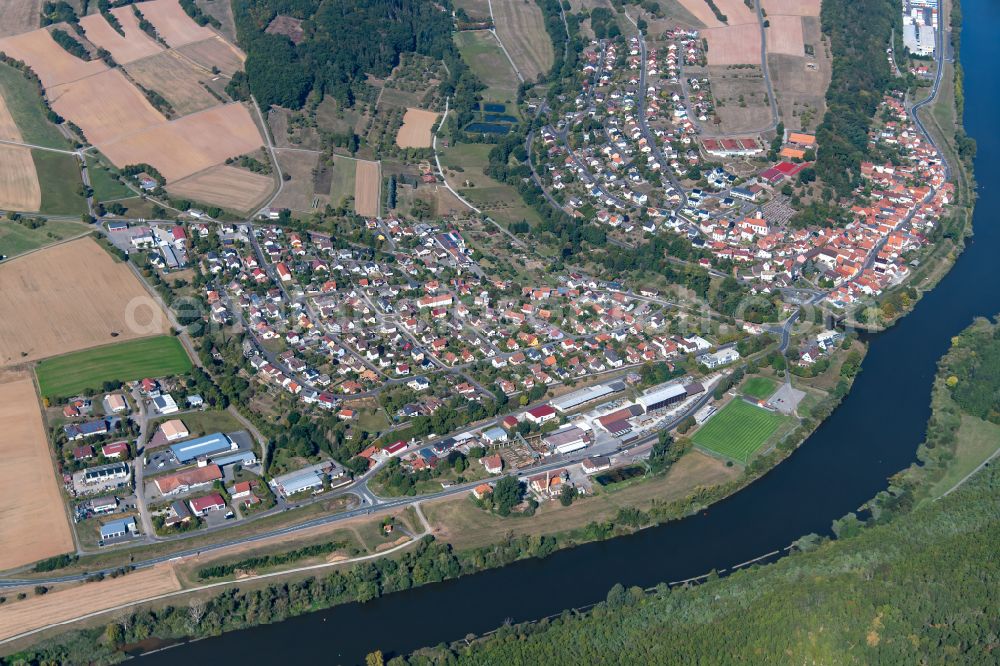 Hafenlohr from the bird's eye view: Village view on the edge of agricultural fields and land in Hafenlohr in the state Bavaria, Germany