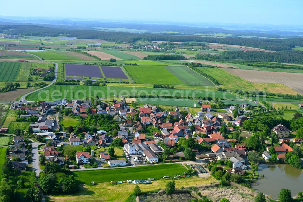 Aerial image Hafenpreppach - Village view on the edge of agricultural fields and land in Hafenpreppach in the state Bavaria, Germany