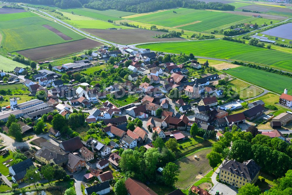 Aerial image Hafenpreppach - Village view on the edge of agricultural fields and land in Hafenpreppach in the state Bavaria, Germany