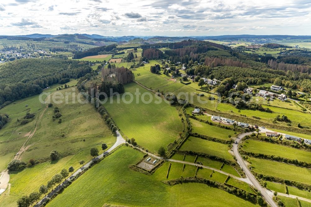 Aerial photograph Brilon - Village view on the edge of agricultural fields and land Am Haidknueckel in Brilon in the state North Rhine-Westphalia, Germany