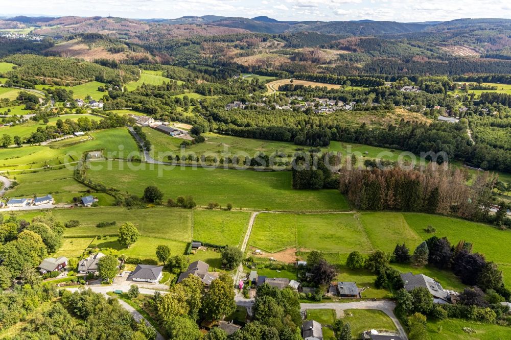 Brilon from above - Village view on the edge of agricultural fields and land Am Haidknueckel in Brilon in the state North Rhine-Westphalia, Germany