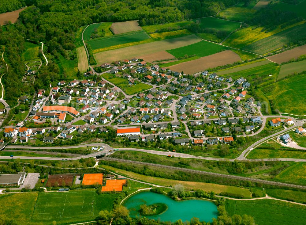 Halzhausen from above - Village view on the edge of agricultural fields and land in Halzhausen in the state Baden-Wuerttemberg, Germany