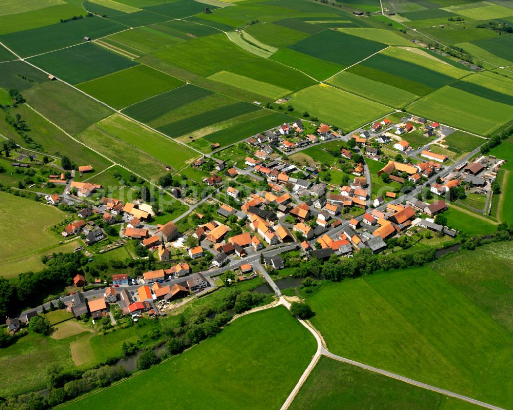 Aerial photograph Hartershausen - Village view on the edge of agricultural fields and land in Hartershausen in the state Hesse, Germany