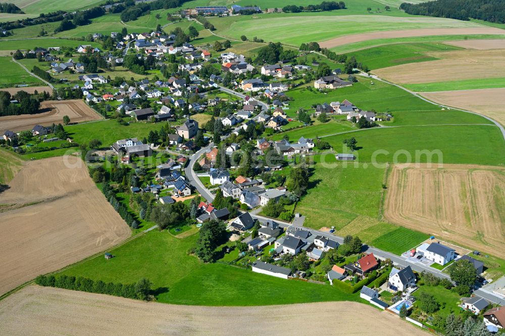 Hartmannsgrün from the bird's eye view: Village view on the edge of agricultural fields and land in Hartmannsgrün in the state Saxony, Germany