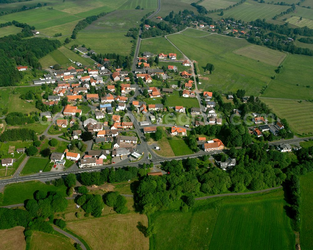 Aerial image Hartmannshain - Village view on the edge of agricultural fields and land in Hartmannshain in the state Hesse, Germany