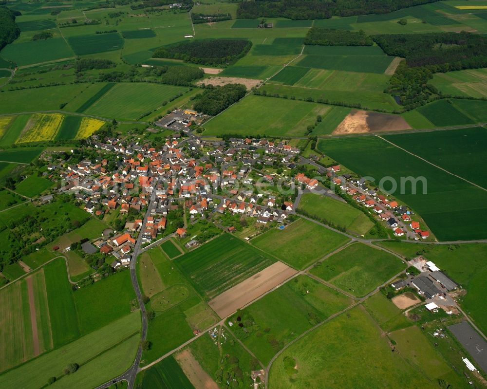 Aerial photograph Hattenrod - Village view on the edge of agricultural fields and land in Hattenrod in the state Hesse, Germany