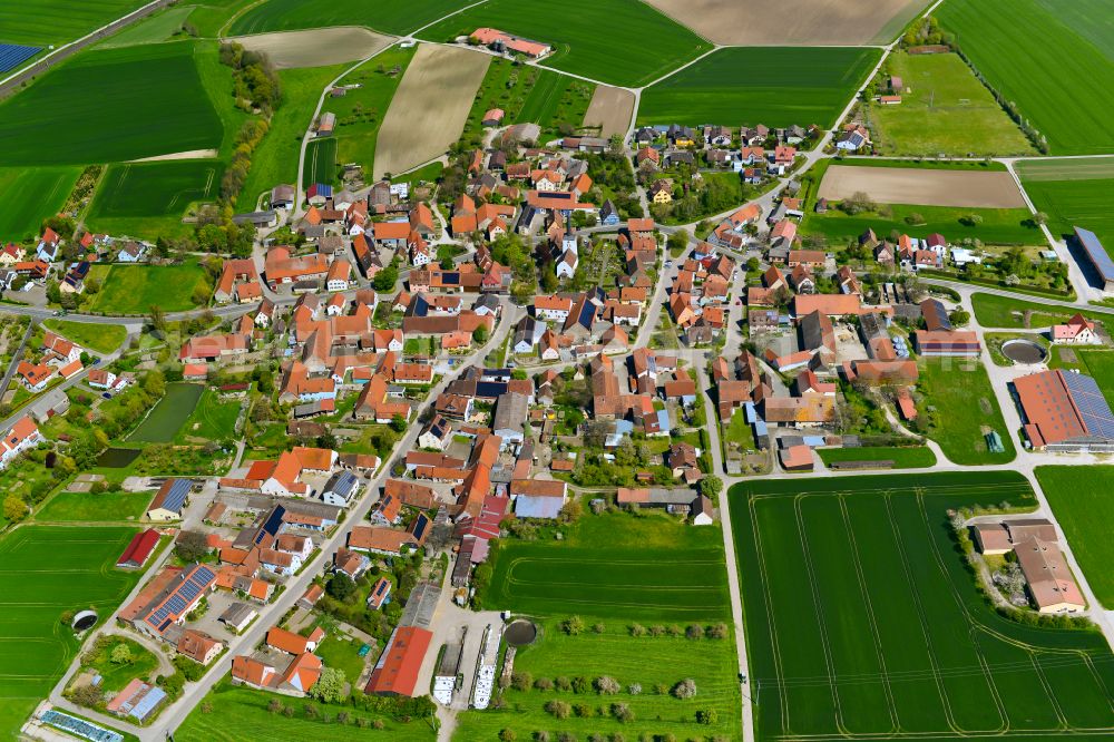 Aerial image Hellmitzheim - Village view on the edge of agricultural fields and land in Hellmitzheim in the state Bavaria, Germany