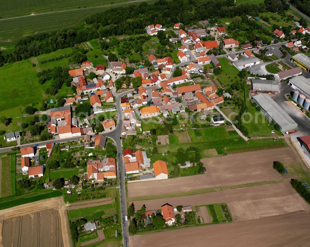 Aerial image Henningsleben - Village view on the edge of agricultural fields and land in Henningsleben in the state Thuringia, Germany