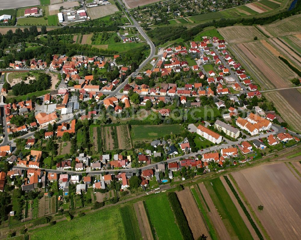 Herbsleben from the bird's eye view: Village view on the edge of agricultural fields and land in Herbsleben in the state Thuringia, Germany