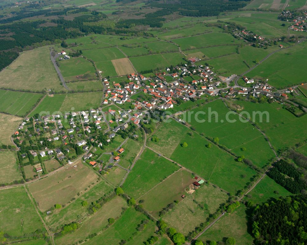 Herchenhain from above - Village view on the edge of agricultural fields and land in Herchenhain in the state Hesse, Germany