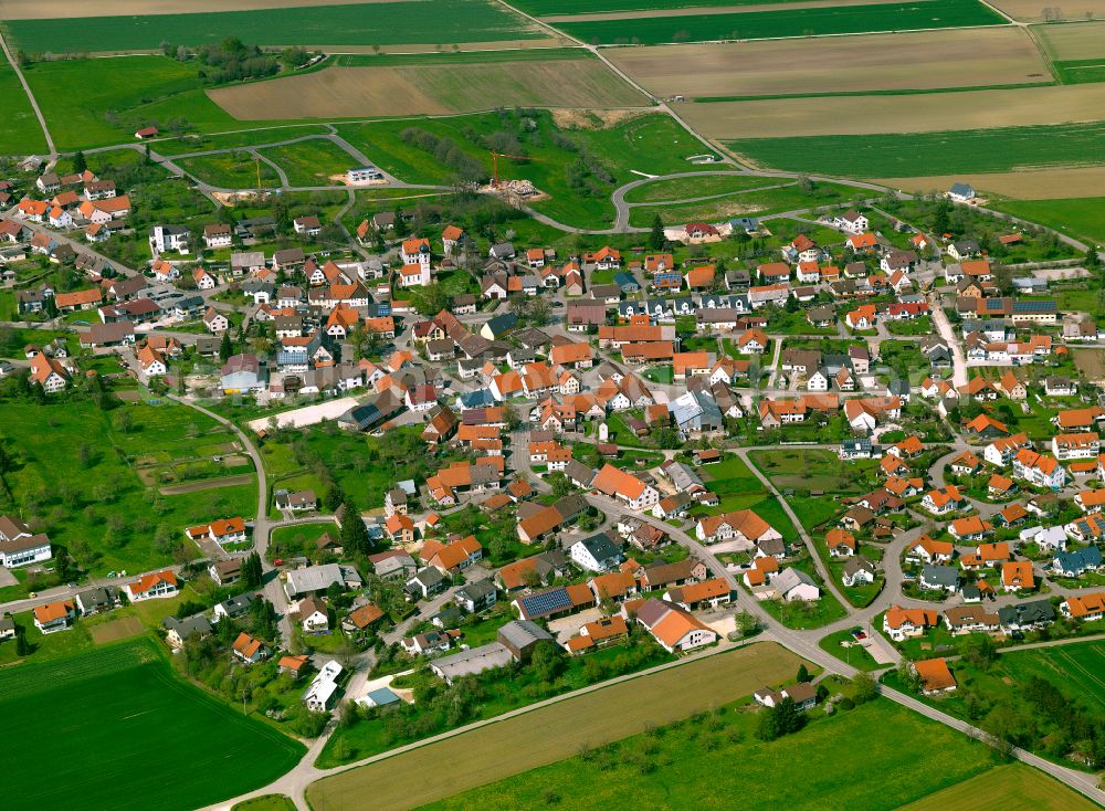 Heroldstatt from the bird's eye view: Village view on the edge of agricultural fields and land in Heroldstatt in the state Baden-Wuerttemberg, Germany