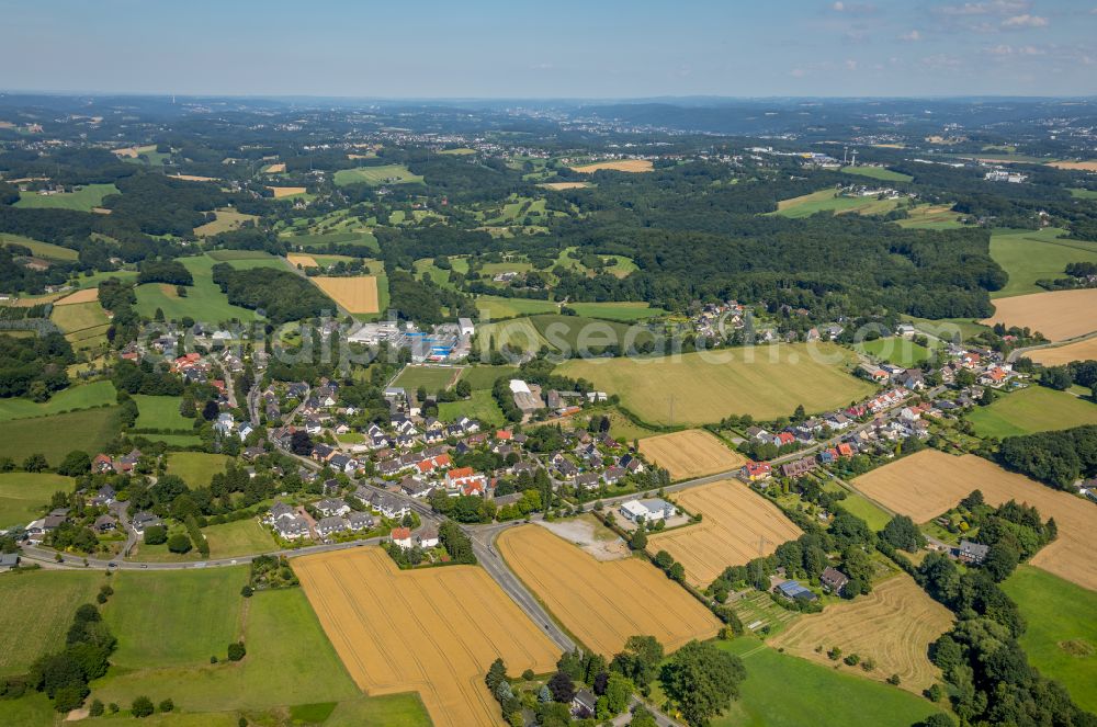 Herzkamp from the bird's eye view: Village view on the edge of agricultural fields and land in Herzkamp in the state North Rhine-Westphalia, Germany